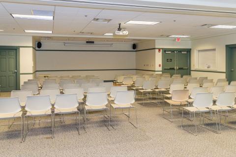 A large room with 60 chairs arranged in rows like a theater