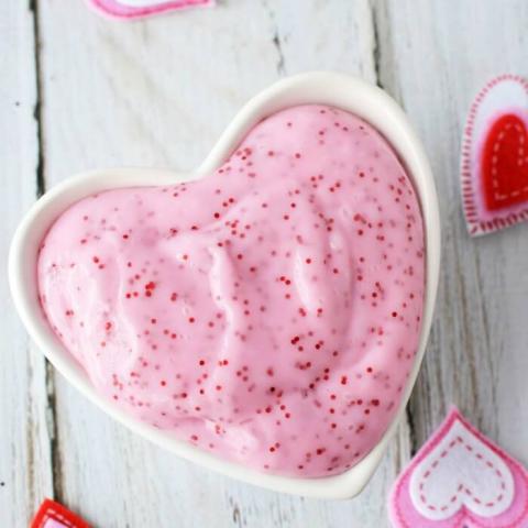 pink glitter slime in a heart shaped container