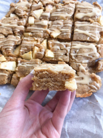 golden brown dessert bars with visible apples and maple glaze