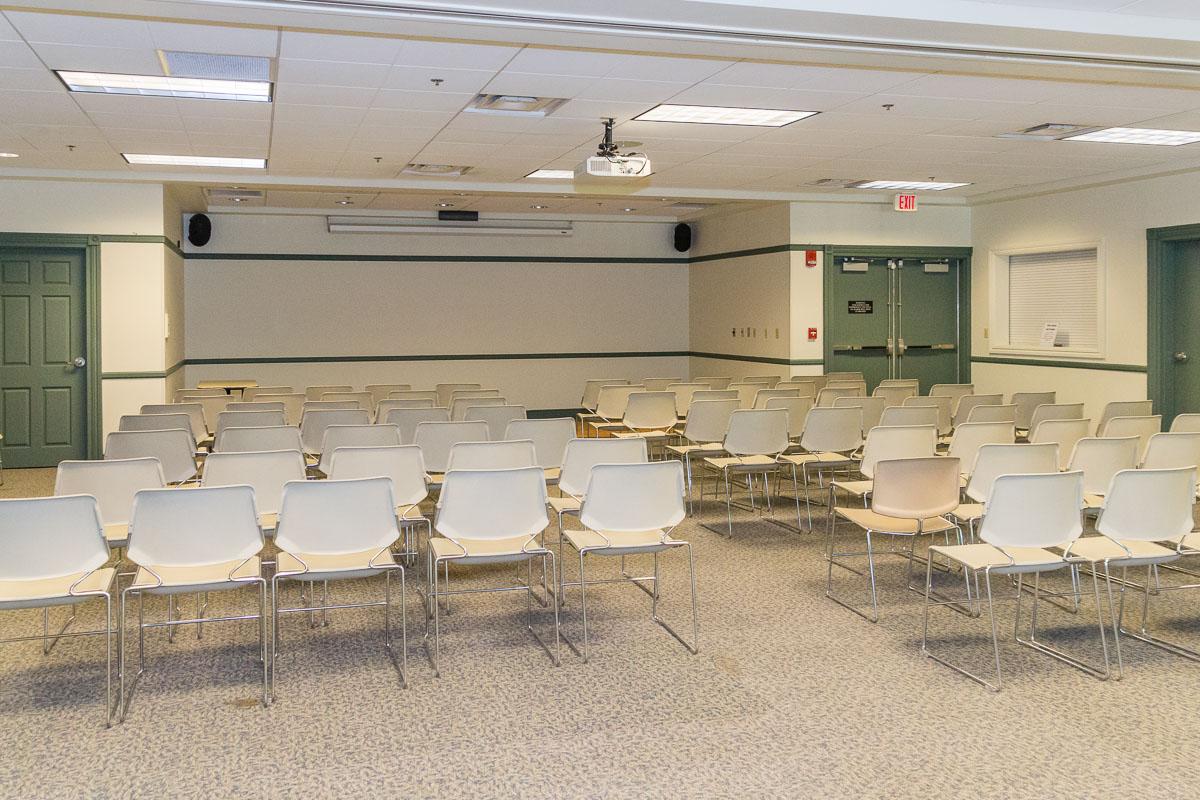 A large room with 60 chairs arranged in rows like a theater